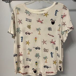 H&M graphic tee. Not cropped but falls at waist line